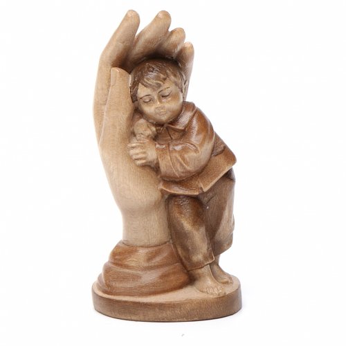 mano protettiva con bimbo legno valgardena multipatinato