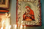 Orthodox old icon in churches and candles